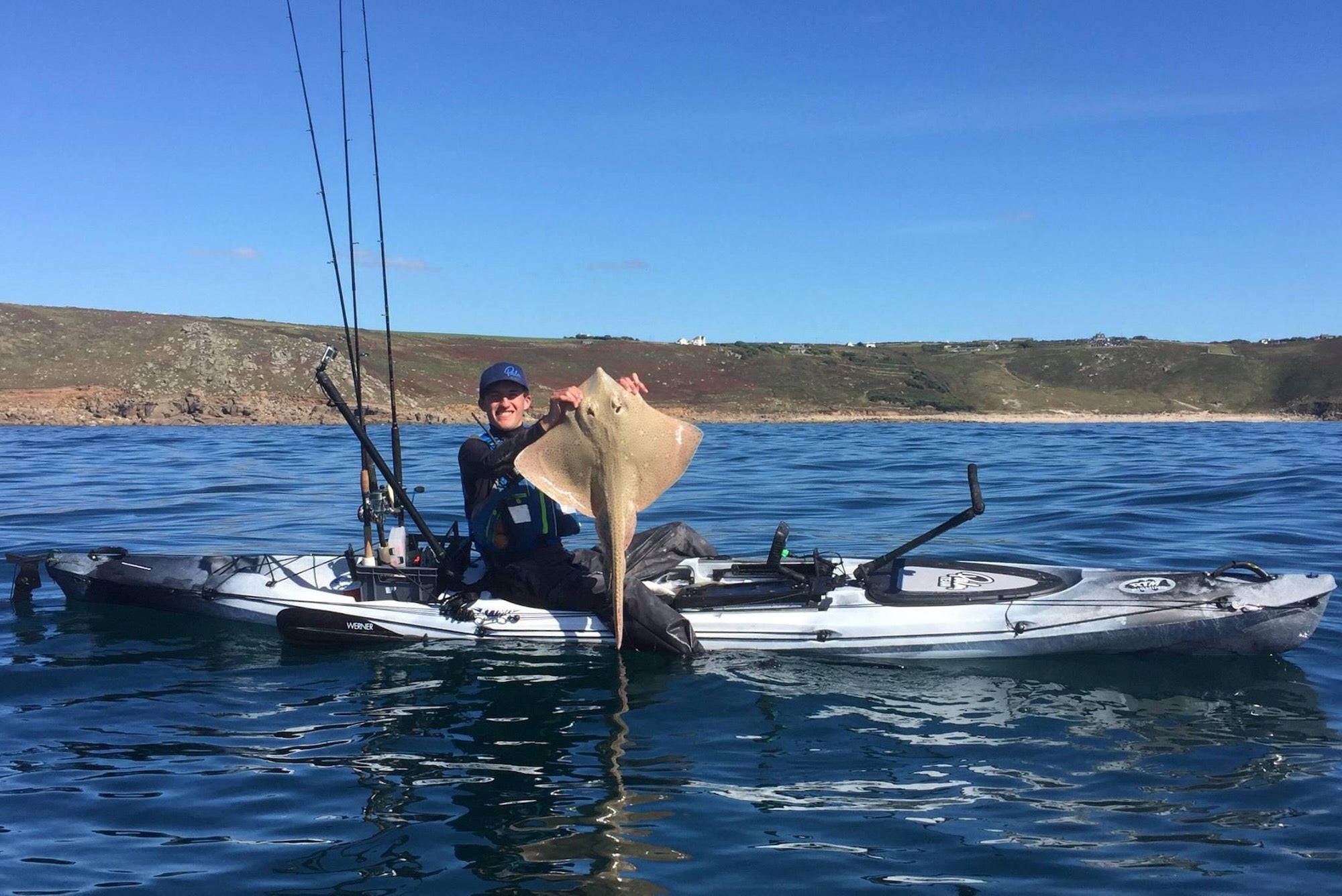 Liam with a Blonde Ray caught on a fishing kayak