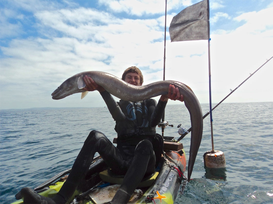 Liam with a Conger Eel caught from his kayak