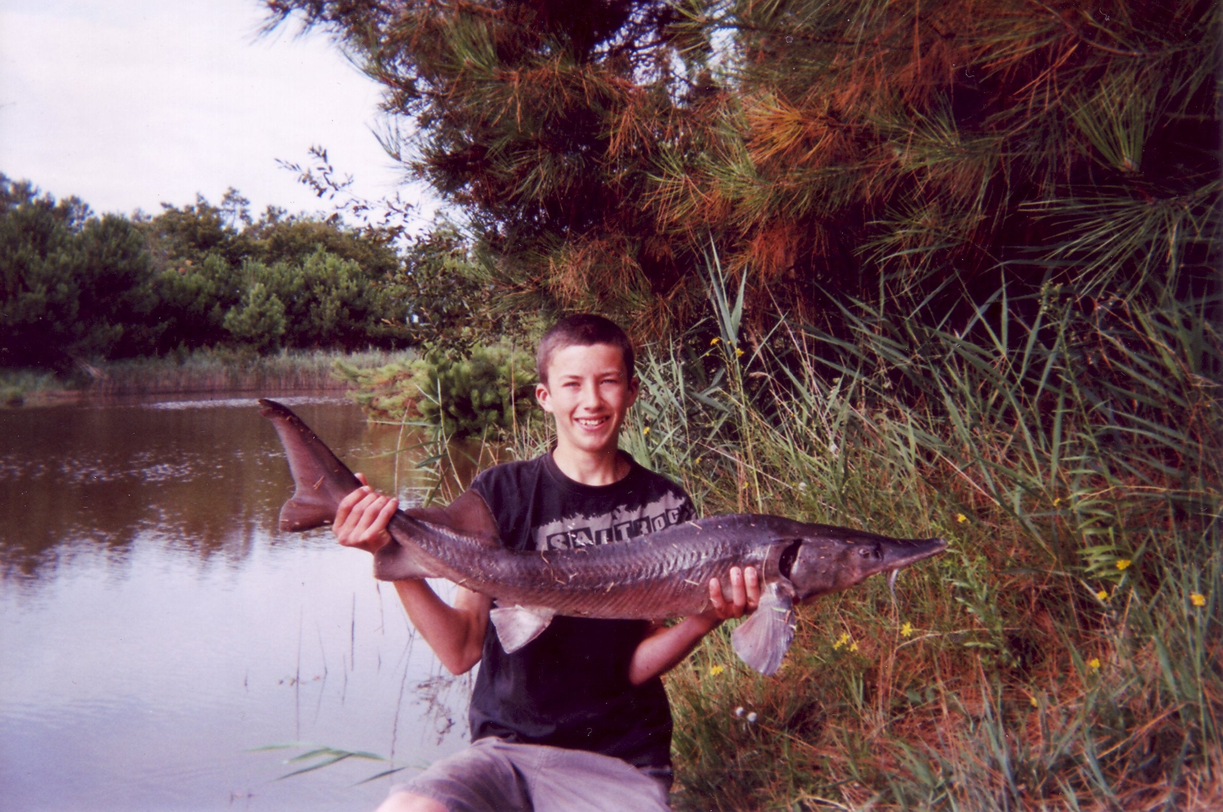 Liam with a Sturgeon caught in France